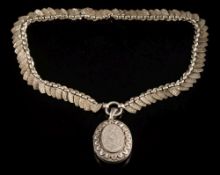 A late 19th century silver necklace: of foliate engraved shield-shaped links,