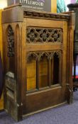 A pair of late Victorian oak pew frontals:, with sloping tops,