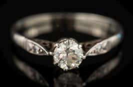 A platinum and diamond solitaire ring: the circular old European-cut diamond estimated to weigh 0.