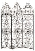 A wrought iron three fold screen:, with shaped ogee cresting and scrollwork designs throughout,