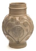 A German Westerwald 'WR' salt-glazed stoneware jug: of bulbous form with ribbed neck and sectioned