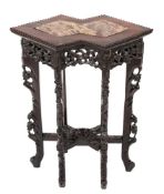A Chinese carved hardwood jardiniere stand:, of twin lozenge outline,