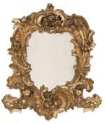 An imposing 19th Century Italian carved giltwood wall mirror:, of cartouche shaped outline,