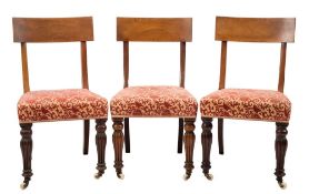A set of eight early Victorian mahogany dining chairs:, the backs with broad curved bar top rails,