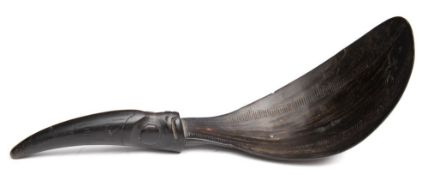 A North West coast native American carved horn spoon: the pear-shaped bowl with two serrated lines