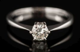 A diamond solitaire ring: the circular, brilliant-cut diamond estimated to weigh a total of 0.