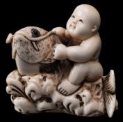 A Japanese carved ivory netsuke,