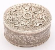 A late 19th century Chinese silver oval box: the lift-off lid decorated with fish,