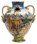 An Italian maiolica ewer: of footed oviform with twin spouts,