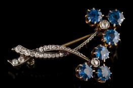 A late Victorian sapphire and diamond floral spray brooch: with two flower heads,