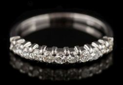 A diamond half-hoop ring: with circular, brilliant-cut diamonds estimated to weigh a total of 0.