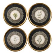 A set of four 19th century decorated silk doilies: each with painted floral decoration to the