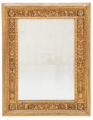 A late 19th Century carved giltwood rectangular wall mirror:, the plate within a spiral ribbon slip,