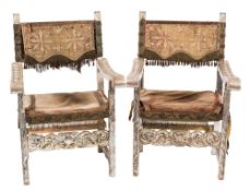 A pair of Italian carved and silvered wood open armchairs:, in the 17th Century taste,
