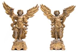 A pair of polychrome and gilded wood angel pricket candlesticks: in the Italianate style with