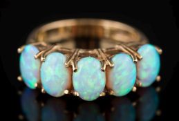 A 9ct gold and opal five-stone ring: each opal approximately 7mm long, 3.
