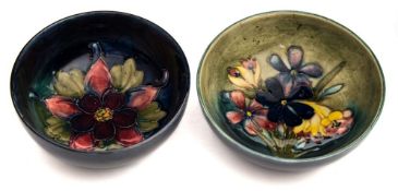 Two Moorcroft pottery dishes: tube lined in colours in the Spring Flowers and Columbine pattern,