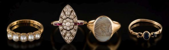 An early 20th century diamond and ruby marquise-shaped cluster ring: with central foliate cluster
