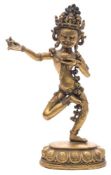 WITHDRAWN LOT 676 A Sino-Tibetan gilt bronze figure of Simhavaktra: in dancing posture with one leg