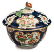 A First Period Worcester blue scale sucrier and cover: with flower finial,