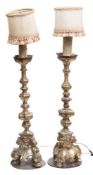 A pair of Italian giltwood pricket candlesticks: of traditional design,