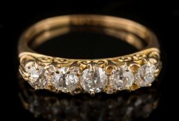 An 18ct gold and graduated diamond five-stone ring: with circular,