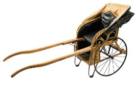 An Edwardian cane perambulator by Leveson & Sons, New Oxford Street London:,