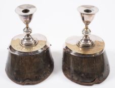 A pair of silver plate mounted hoof candlesticks inscribed 'Solomon':, 19cm high.