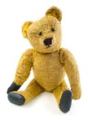 An early 20th century golden plush Teddy bear:, with boot button eyes ,