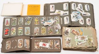 Three albums of sets and part sets of cigarette cards:, including Players , Wills and others,