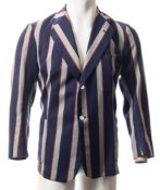 A cricket blazer, with navy blue grey and red stripes: together with a faux fur coat and stole.