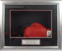 An Everlast boxing glove signed by nine World Heavyweight Champions:, Muhammad Ali, George Foreman,