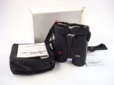 A pair of Leica 10 x 42 BA binoculars:, black reinforced casing in a soft leather case,