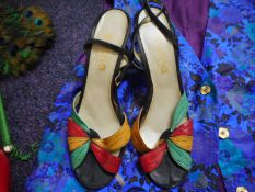 A pair of Sacha high heel shoes: a pair of red leather high heel shoes, blue suede ankle boots,
