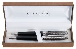 A late 20th century Cross pen set:, black with milled plated ends in original case..