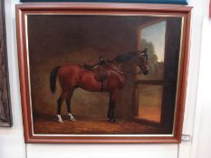Manner of Alfred Wheeler [19th Century]- Bay in a stable interior:- oil on canvas 55 x 67cm.