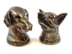 A silver plated two-piece cruet set in the form of fox and hound heads:, 6cm high.