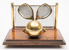 An early 20th century brass and oak tennis inkstand:, 17cm wide.