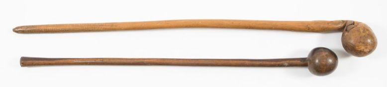 An African root wood knobkerrie and a hardwood knobkerrie (2):.