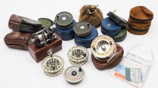 An Abu 'Ambassadeur 6000' multiplier reel together with a collection of various fly reels and fly