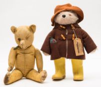 A Chad Valley Paddington Bear:, in brown felt hat and duffel coat and yellow Wellington boots,