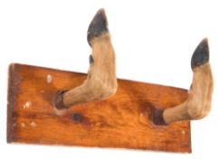 A deer slot coat hook:, together with an early 20th century brass and bamboo landing net.