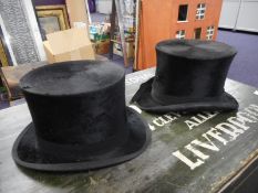 A black silk top hat by Pinder & Tuckwell, Exeter:, another by Charles Edwards,