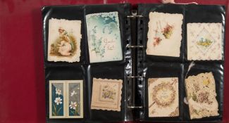 Two postcard albums containing Victorian, Edwardian and later postcards: relating to greetings,