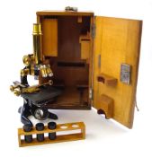 A black lacquer monocular microscope by Ernst Leitz, Wetzlar: number 242683,