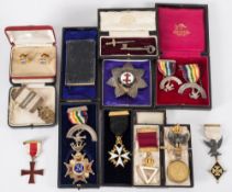 A collection of silver gilt and enamel Masonic jewels:, including an Order of St John and others,