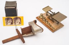 An Underwood & Underwood stereoscopic viewer with a collection of cards:,