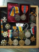 Two WWI medal groups:, comprising a set of four to '8612.