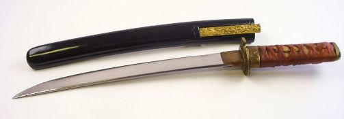 A Japanese tanto:, unsigned, the 12 inch blade over a copper habaki and gilt tsuba,