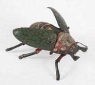 A Lehman No 431 tinplate clockwork 'Crawling Beetle':, with lithograph printed body and wings,